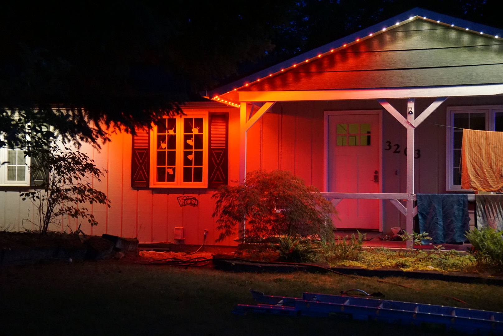 Warm Orange Color Wash — permanent exterior lighting in Front elevation